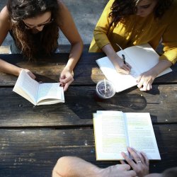 https://unsplash.com/photos/woman-reading-book-while-sitting-on-chair-omeaHbEFlN4