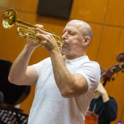 Michael Mossman playing trumpet during a Latin jazz performance