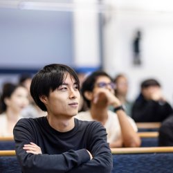 Student seated in lecture theatre