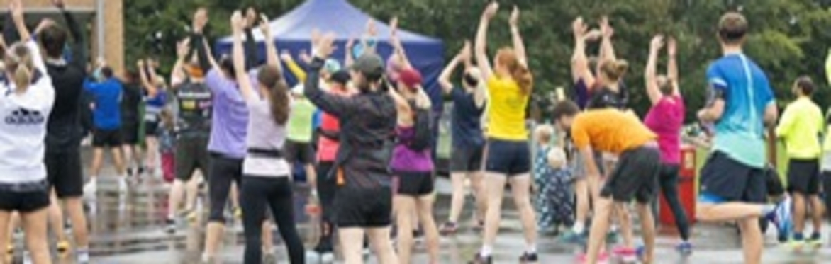 Runners stretching pre race