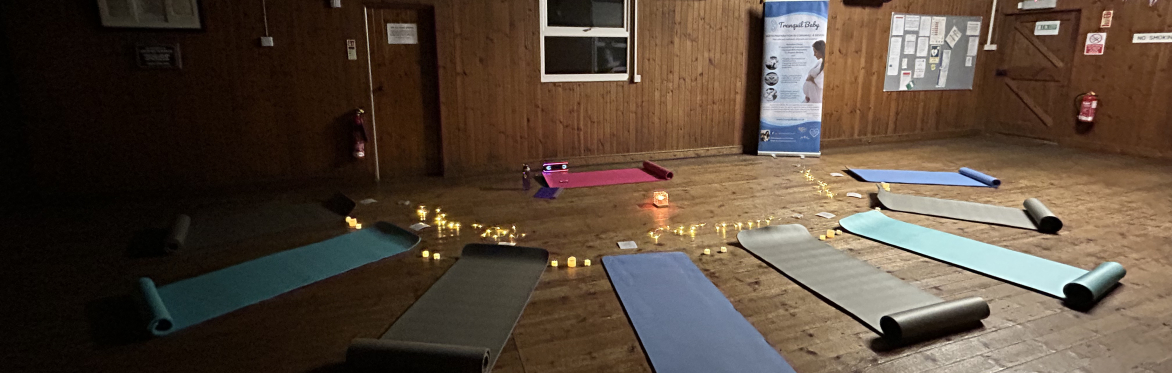Room set up for Pregnancy Yoga and Relaxation with yoga mats and dim lighting