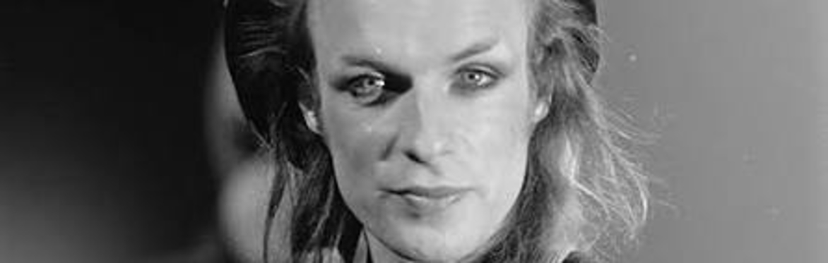Brian Eno in makeup, looking glam even with thinning hair.