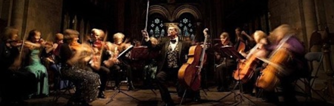 Chamber Orchestra with conductor and cello in Chapel