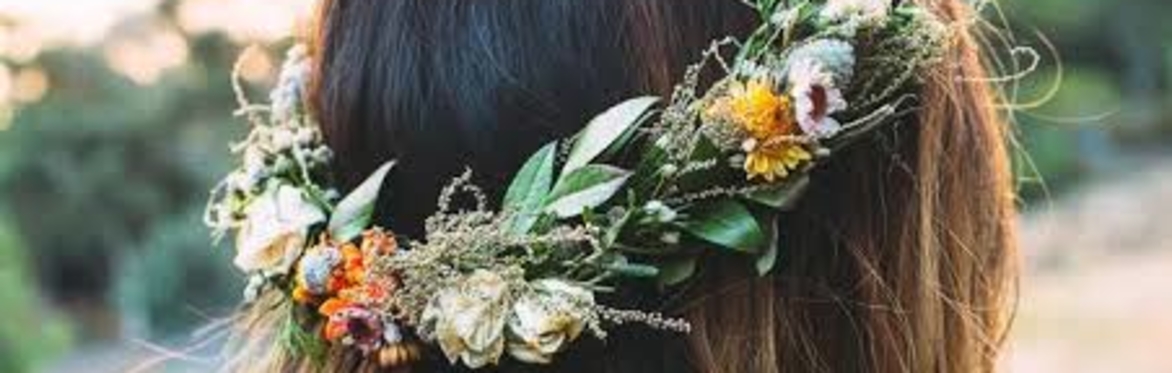 A handmade floral wreath easily worn on the head.