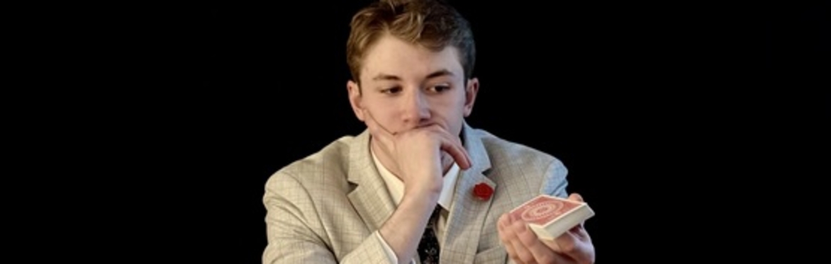 Mason Michael Magician contemplating cards
