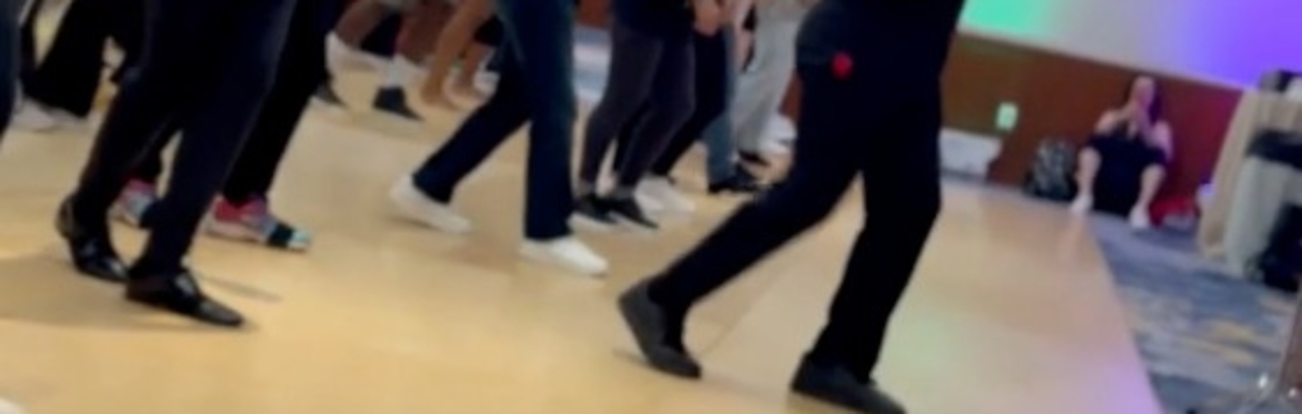 Dancers in a salsa class with congas in the foreground.