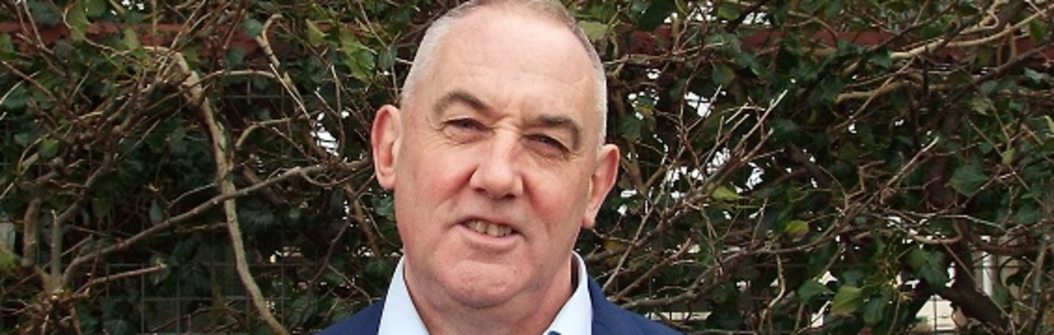 Paul McLennan with some greenery behind