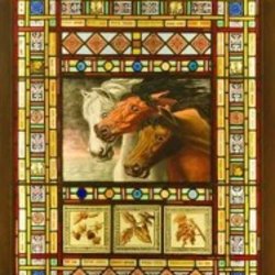 a stained glass window featuring horses in centre of design