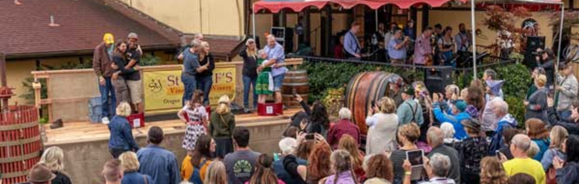 Three Couples stomping grapes in the barrel