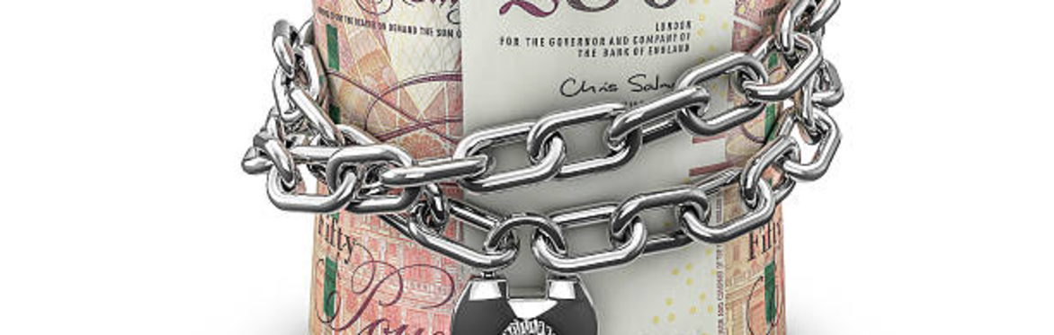 Roll of bank notes locked up with a chain and padlock