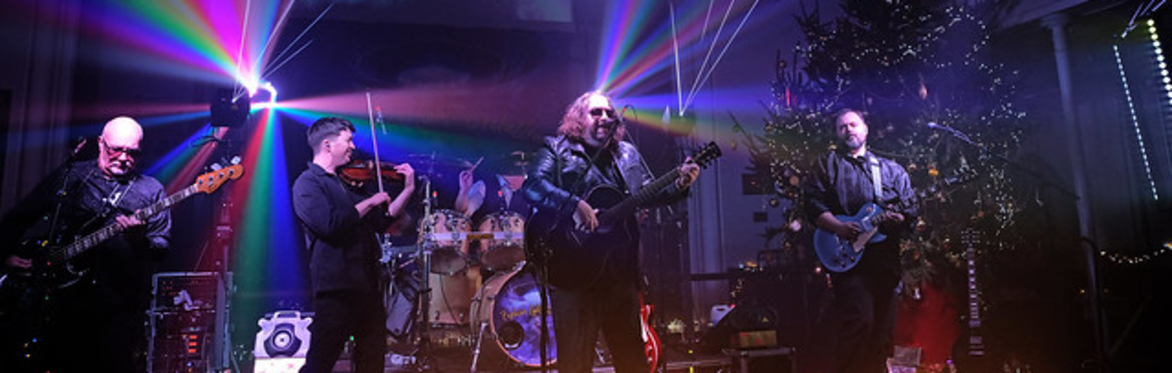 Explosive Light Orchestra band with bright purple stage lighting