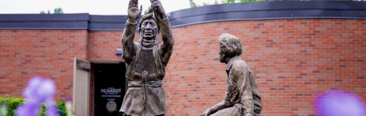 "Sharing the Vision" sculpture in front of Neihardt Center