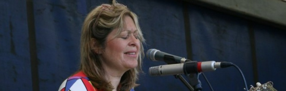 Head shot of singer with microphone