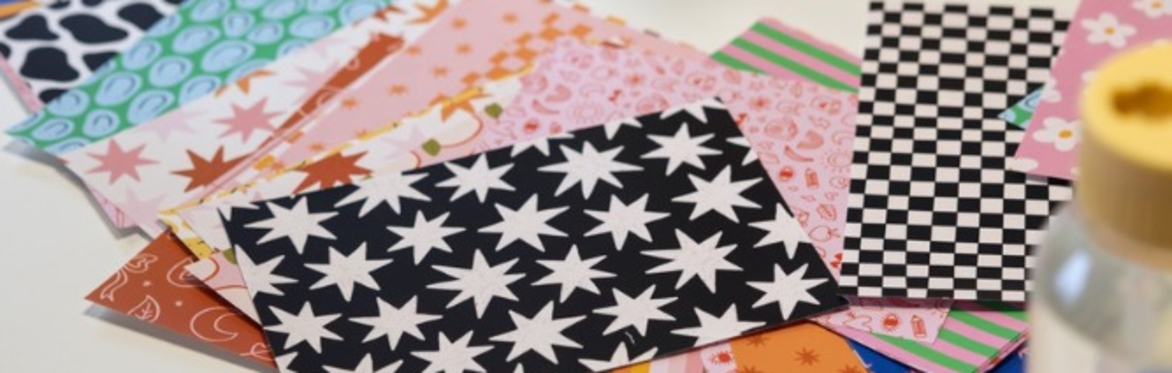 An array of bookbinding tools along with a handover book with red printed pattern