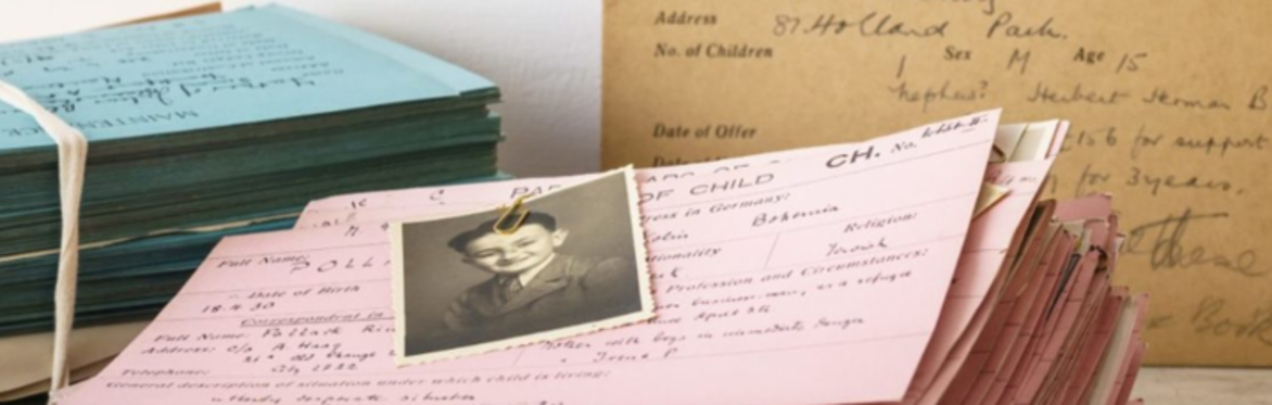 Stack of old letters and paperwork with a black and white photo