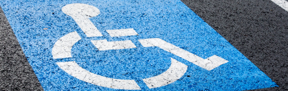 An image of a blue box, with a white visual of a wheelchair inside.