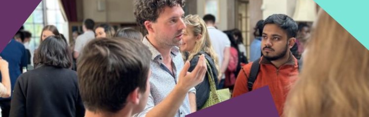Students talking to Dr LIam Beiser McGrath at the Buzz event