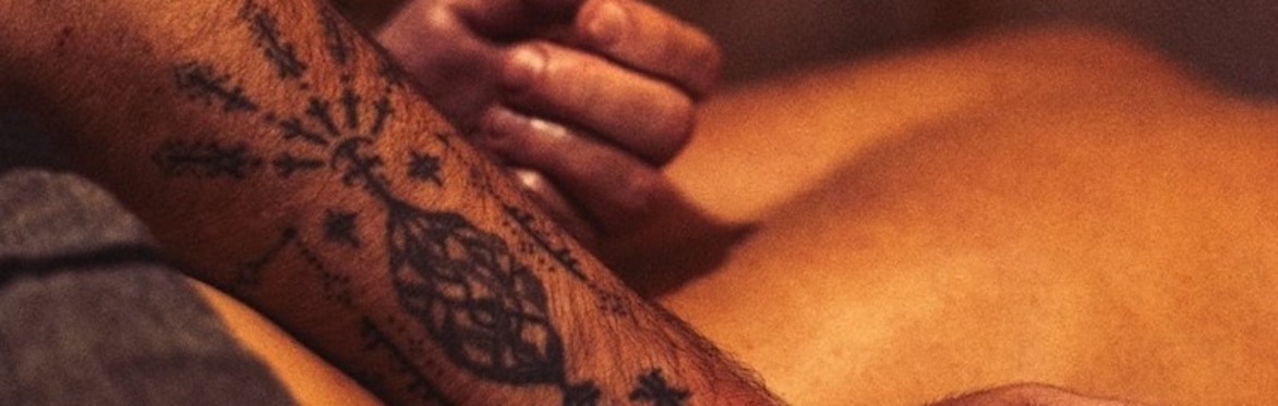 Bear's hands massaging someone's back