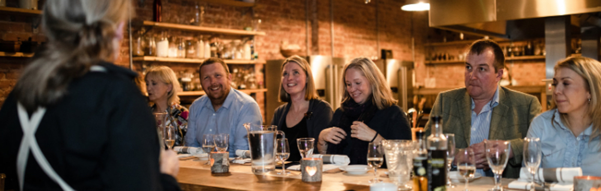 Party of people enjoying a meal and a drink