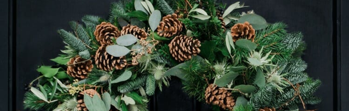 Christmas Wreath with fir cones and lush green foliage.