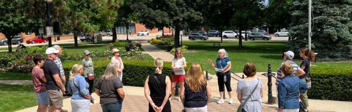 A docent giving a guided history tour of Cook Park in Libertyville, IL.