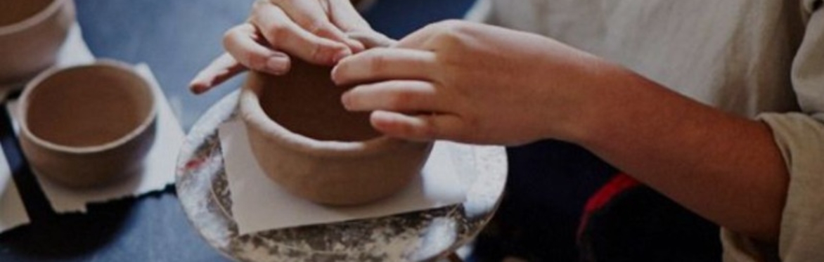 Image of Hannah Lawrence making a small pot.