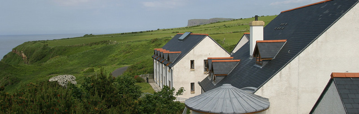Corrymeela main house with sea behind