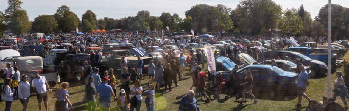 Thousands of people enjoying the Classic Car Show on a bright sunny day