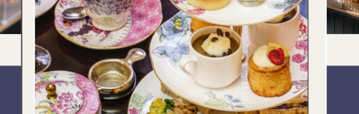 Photo of a table set with a cakes, traybakes, cups of tea for afternoon te