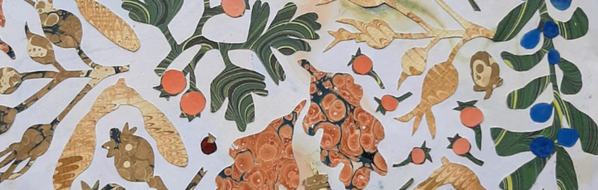 A paper collage of autumn leaves and berries created from marbled papers
