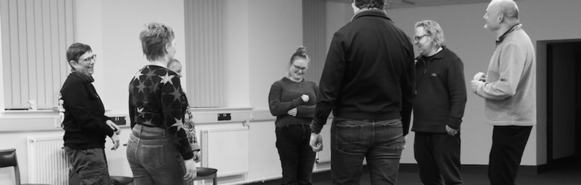 Students standing in a circle at an Improv Comedy Workshop