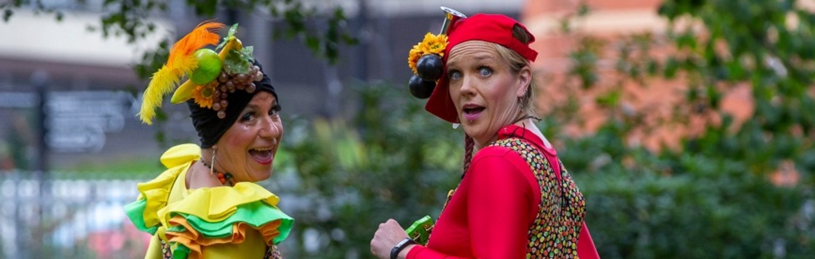 Natalie Speake and Gill Burns from Kerfuffle Street Theatre dressed in fruity clown costumes