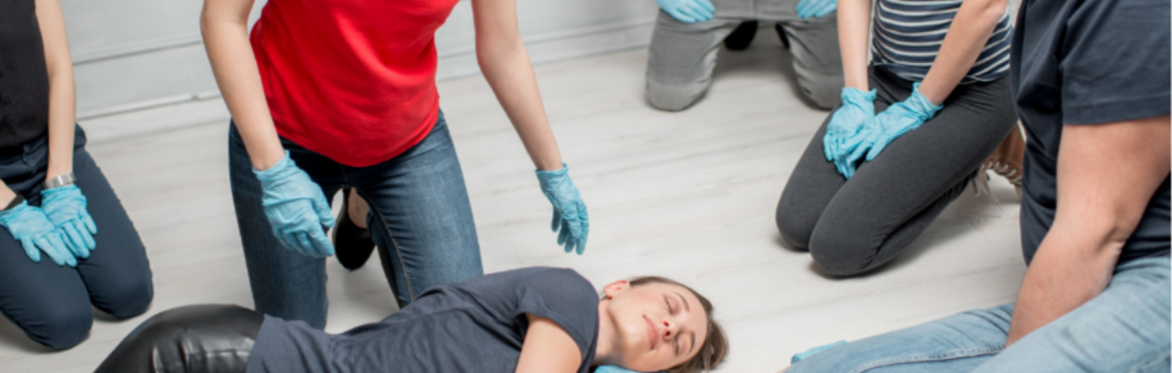 First aid course participants practising the recovery position during PHECC First Aid Response training in Ireland.