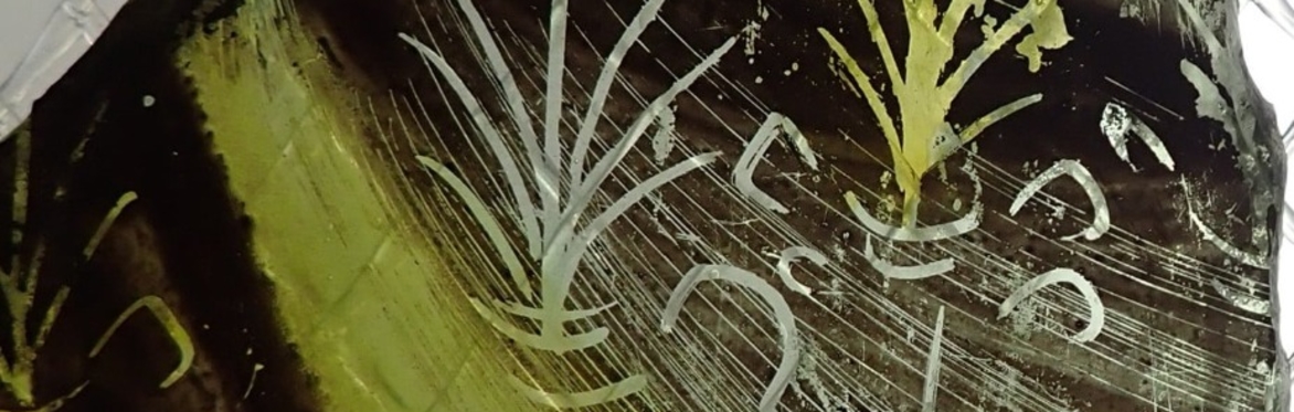 Fragment of predominantly yellow and black mid fifteenth century stained glass from St Michael's (Coventry's second Cathedral) showing foliage and on the left, the top of a shroud, pleated fabric tied