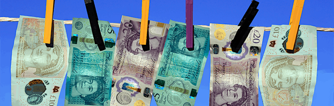 5, 10 and 20 pound notes pinned to a washing line