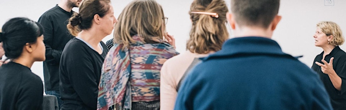 Gill on the right, talking to a group of workshop workshop participants