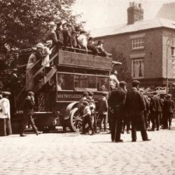 black and white photograph of old fashioned bus