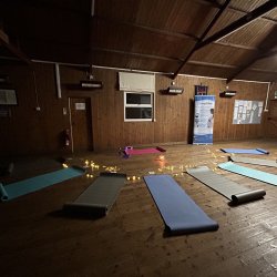 Room set up for Pregnancy Yoga and Relaxation with yoga mats and dim lighting