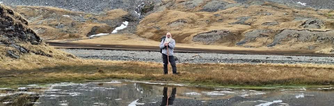 Photo of polar explorer Gerard Baker in hilly setting