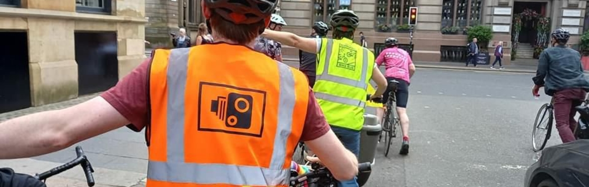 Photo of parents and children on a led bike ride