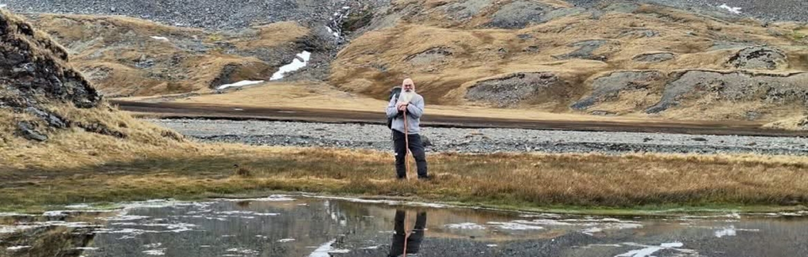 Photo of polar explorer Gerard Baker in hilly setting