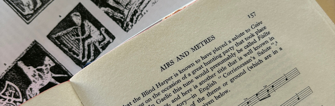 books with illustrations of harps and sheet music