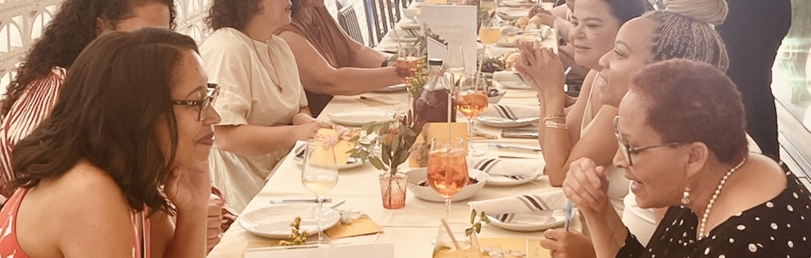 women at long brunch table