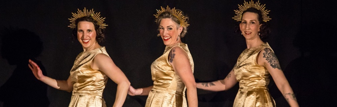 Women smiling and dancing.