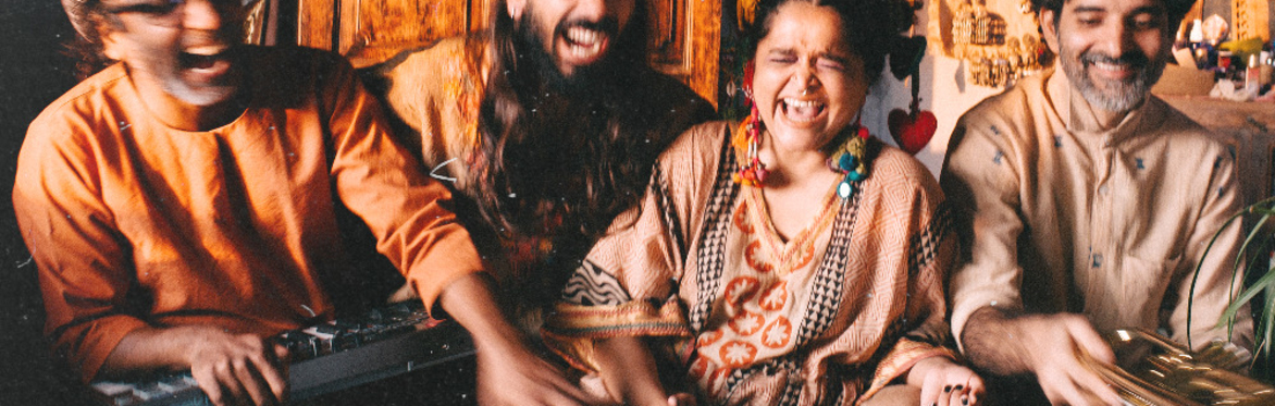 An image of four members of the Tapi project. laughing