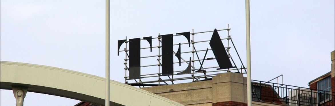 A view of the "TEA" sign on top of the Tea Builder (our venue this month) - seen through the supports of the bridge carrying the TfL overground line that runs infront of the building