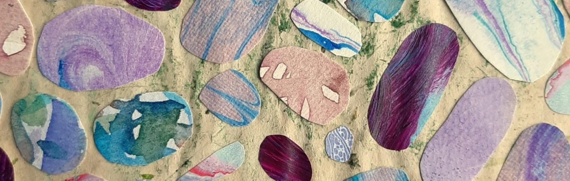 A paper collage of paper pebbles cut from marbled and painted papers.