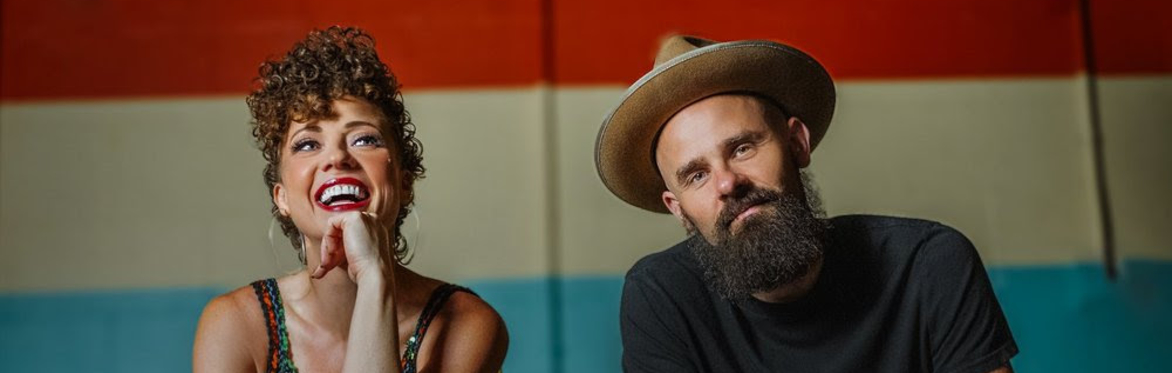 Golpine duo seated on mustard chairs against a striped wall, smiling and relaxed, promoting their May 31, 2026 show at the 610 courtyard.