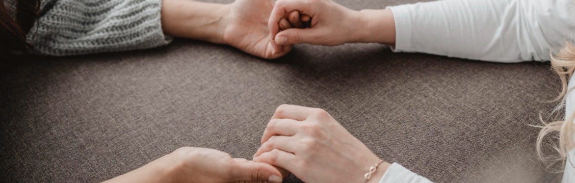 two people holding hands
