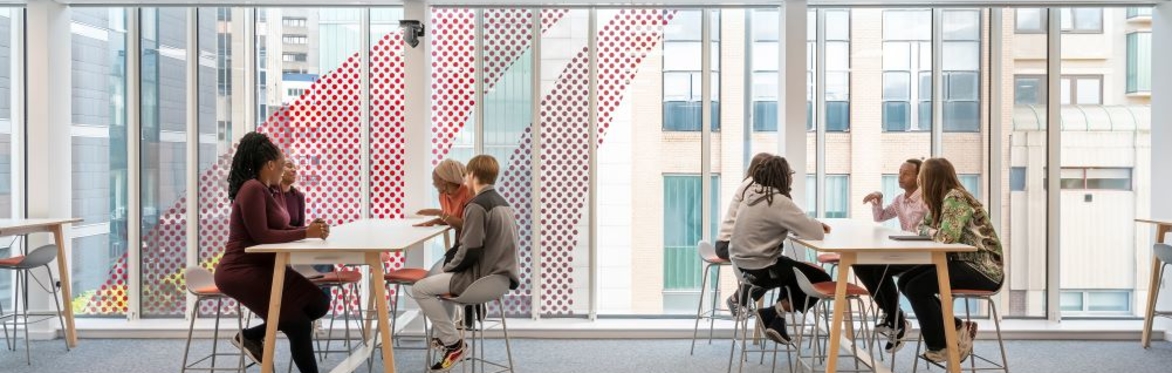 Students working together in open plan room